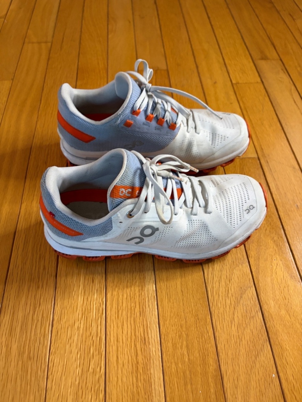 On Running White and Orange Women's Athletic Shoes